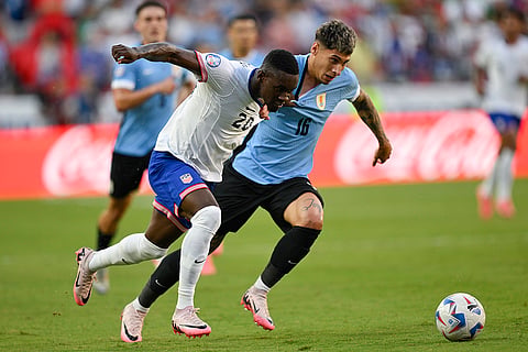 Folarin Balogun and Mathias Olivera battle for the ball